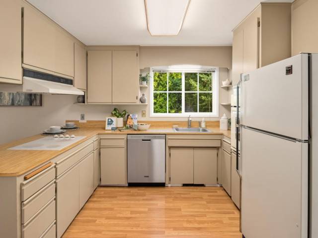 Just off of the dining room is the kitchen and "Family room"/informal dining area. A friendly layout for entertaining and lots of potential for upgrades.