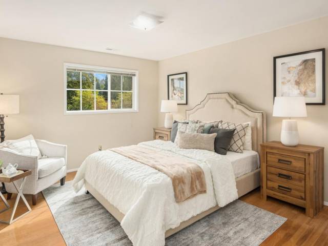 2nd floor large bedroom at the top of the stairs is away from the other 3 bedrooms. Wall with bed could likely be removed to turn both beds into a large master suite. Just a thought!