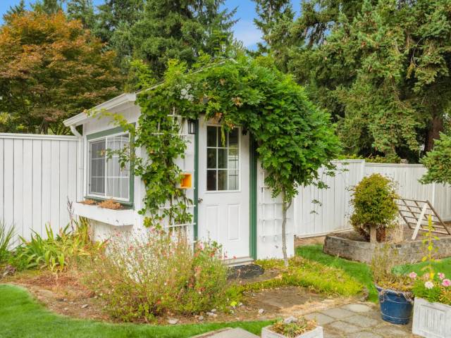 A cute little gardening shed will help to keep the flower beds and raised garden beds tuned up all year round.