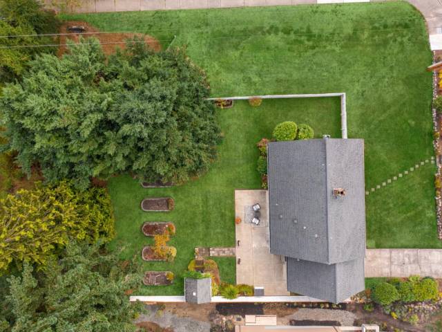 Great layout with lazy incline at the front but relatively flat otherwise. Fence does not reflect lot lines as those stretch all the way to the sidewalk.