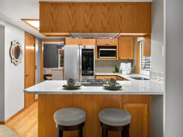 Behind that door is a large walk in pantry for easy access and a ton of great kitchen storage.