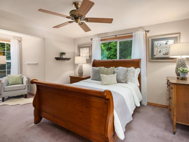 A large primary suite with attached bath and large walk in closet.